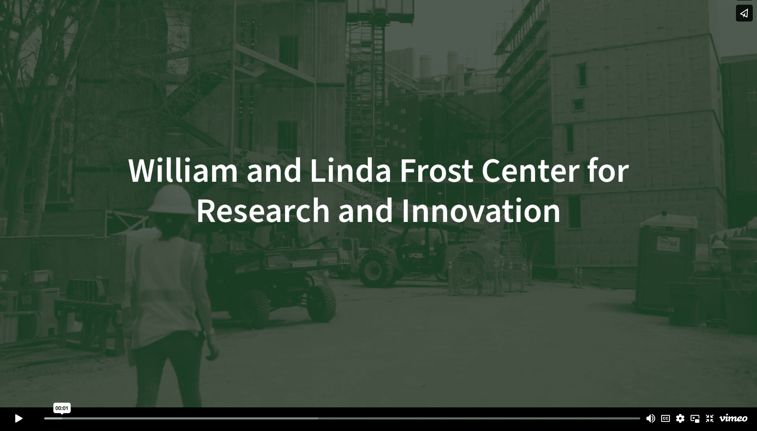 Construction site with worker in safety vest and helmet, text "William and Linda Frost Center for Research and Innovation.