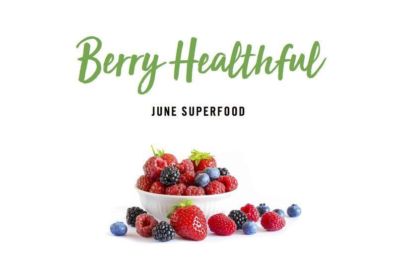 Bowl and scattered mixed berries including strawberries, raspberries, blueberries, and blackberries with text "Berry Healthful June Superfood".
