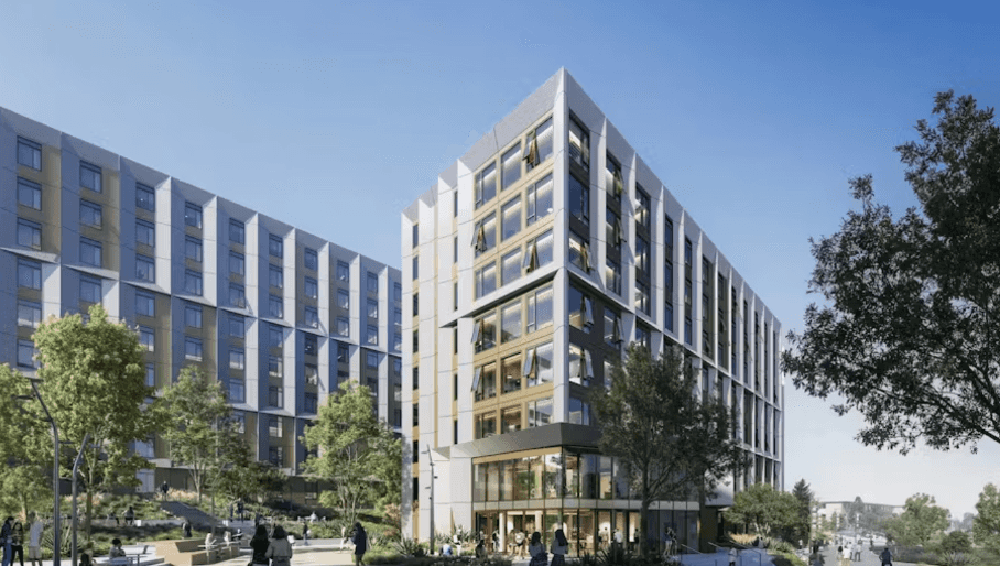 Modern, multi-story residential buildings with large windows and surrounding greenery under a clear blue sky.